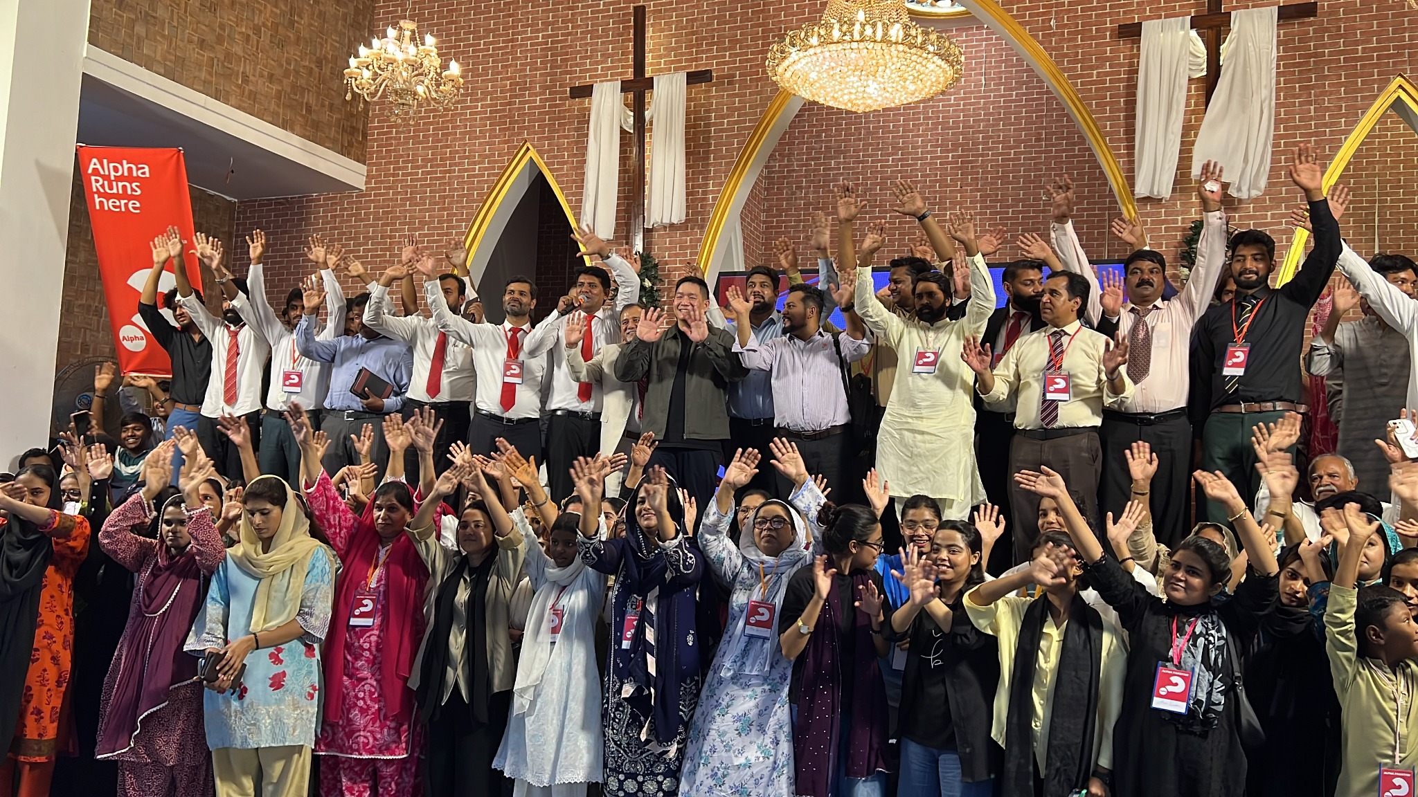 Participants gather for a celebratory photograph during the Alpha refresher training.