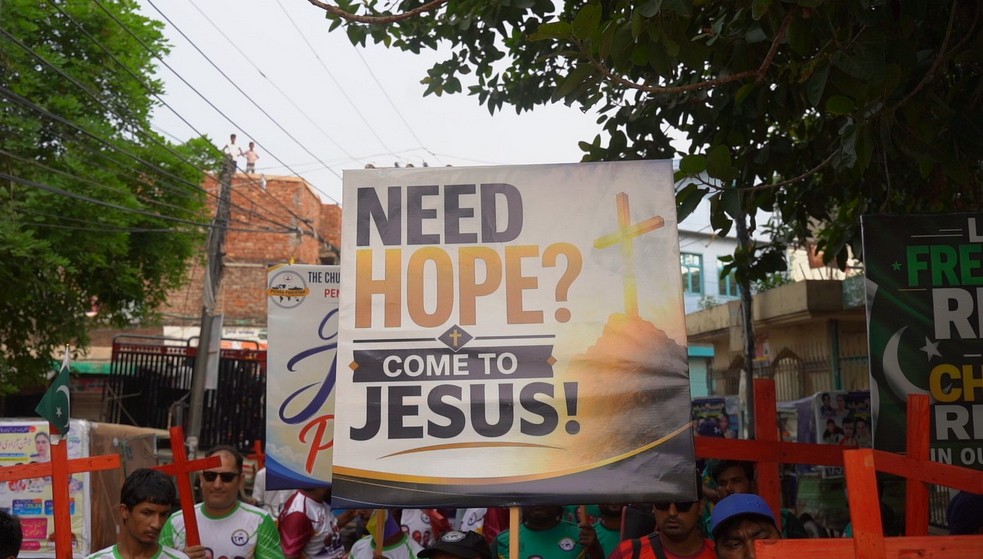 A rally banner points to hope in Jesus Christ.